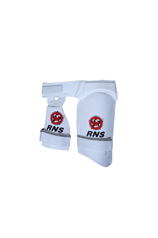 White knee pads with red and black logos on a green background